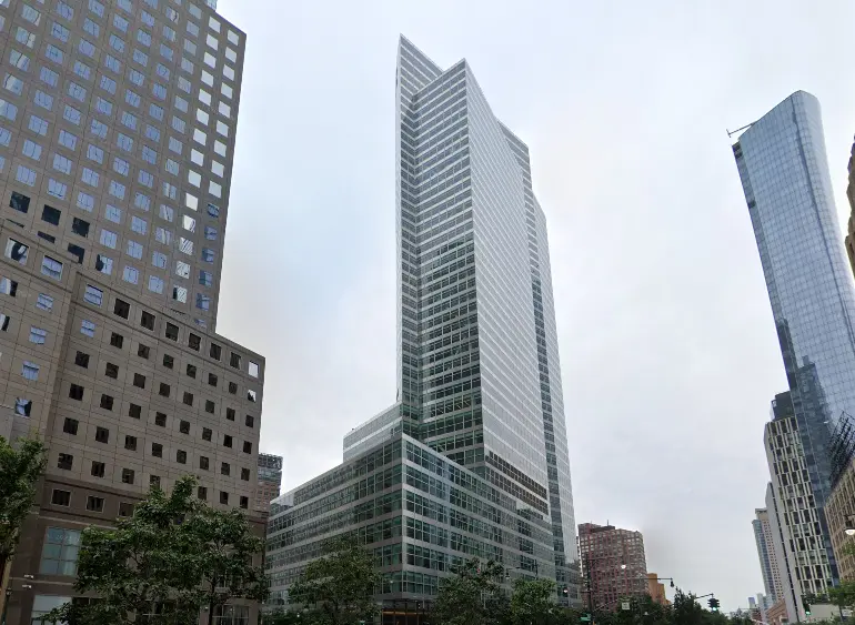 Goldman Sachs headquarters building towering among other skyscrapers.