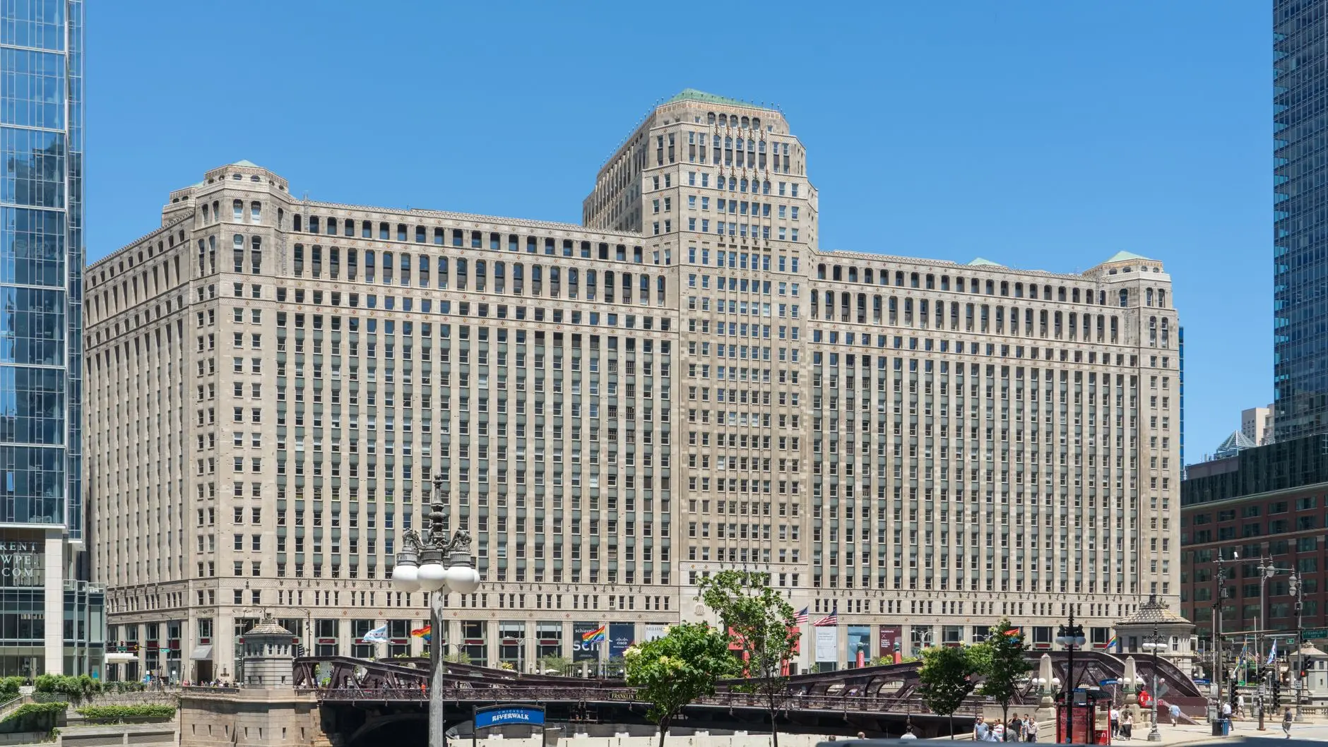 Exterior view of the historic CME Group building in Chicago overlooking the riverwalk