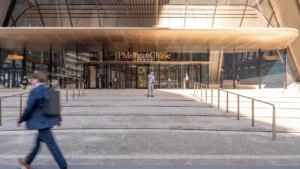 The entrance of the JPMorgan Chase headquarters at 270 Park Avenue with people walking by.